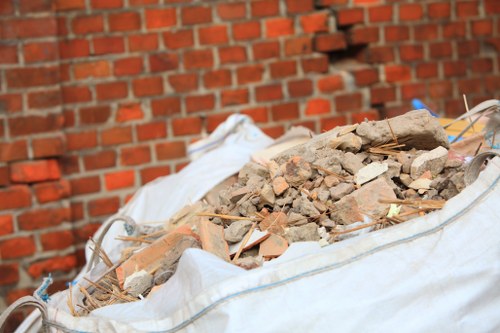 Image of a professional loft clearance team inspecting an attic space in Tower Hamlets.